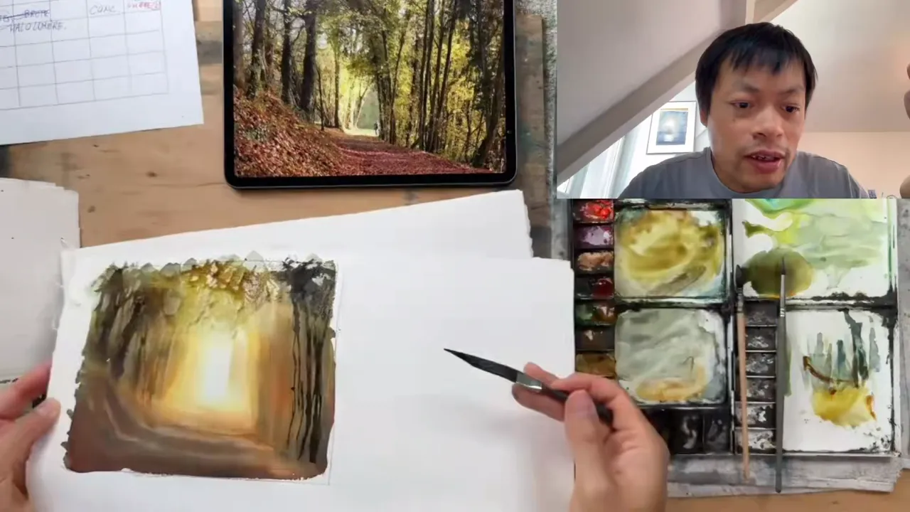 The finished forest path watercolor, next to the planning table and palette